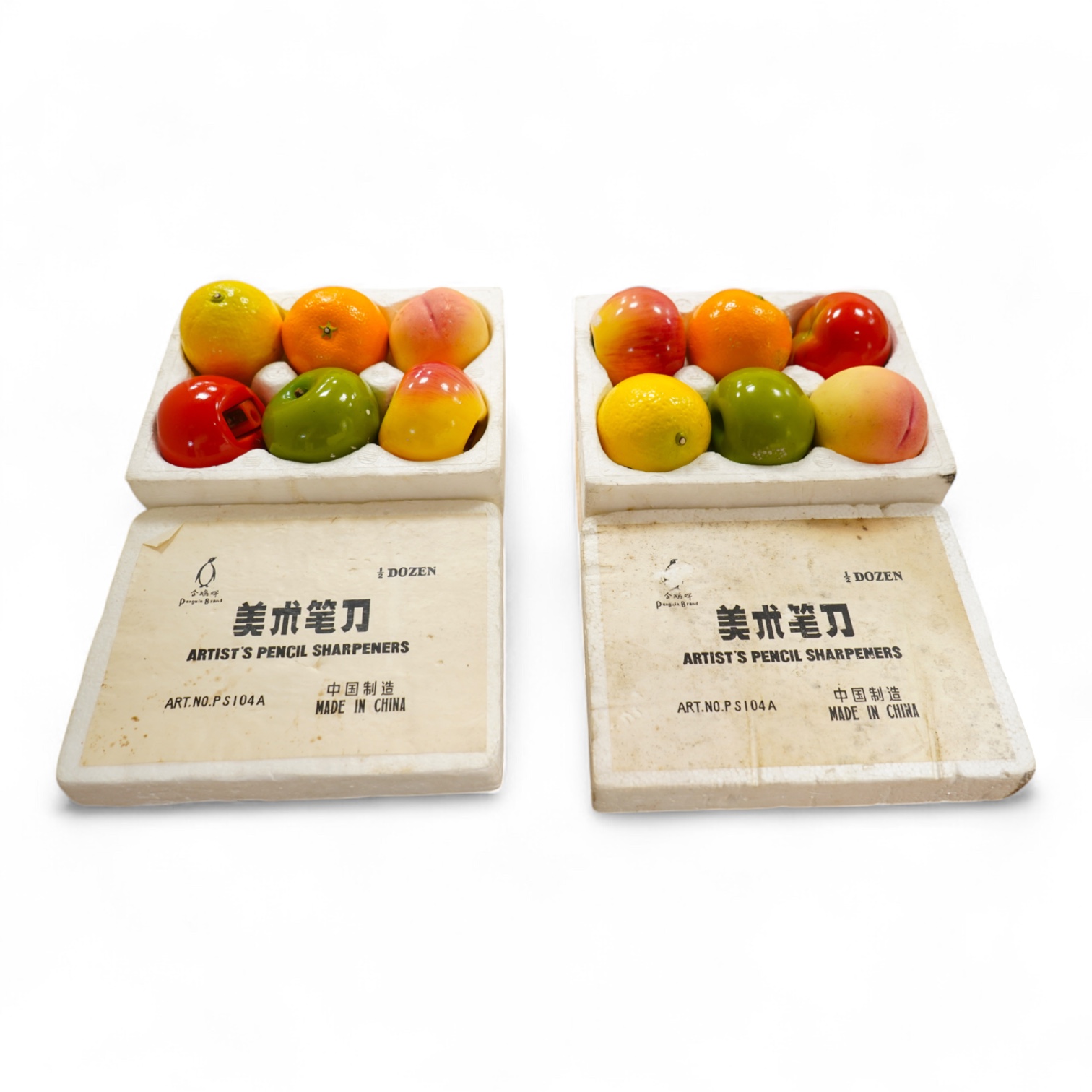 Two boxed sets of novelty Chinese Penguin Brand pencil sharpeners in the form of fruit